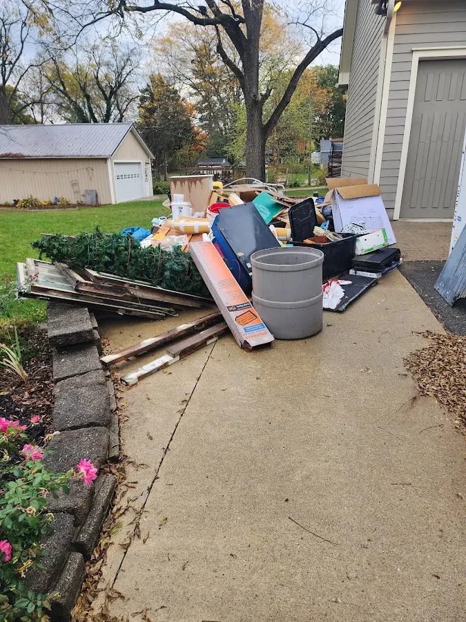 Dumpster being loaded with debris for Commercial Dumpster Rental in Lake Mary